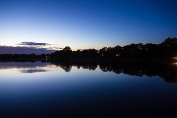 Obraz premium forest by the lake at dusk, long exposure