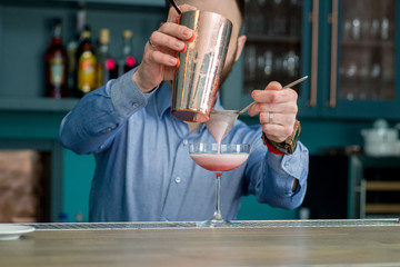 bartender prepares a great cocktail