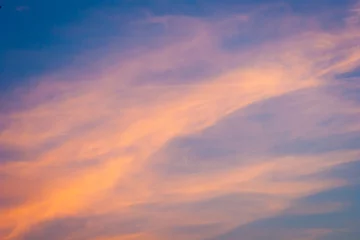 Papier Peint photo Lavable Ciel orange cloud on a blue sky background. Amazing view during sunset