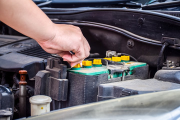 Man with checking car engine.