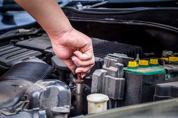 Man with checking car engine.