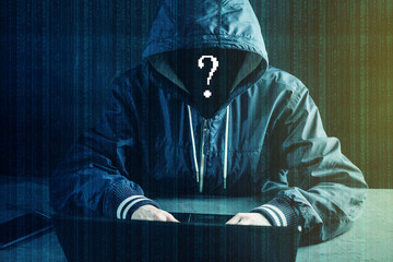 Anonymous hacker programmer uses a laptop to hack the system. Stealing personal data. Concept of...