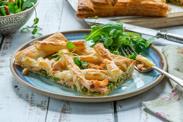 Salmon and broccoli tart with fresh leaf salad