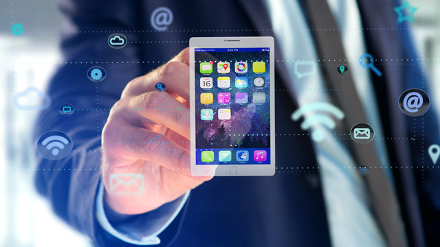 Businessman holding a tablet surrounding by app and social icon - 3d render