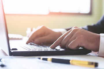 Business man analyze  hand keyboard working at office