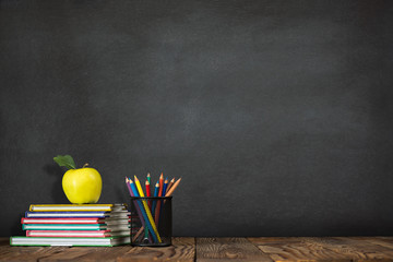 Back to School Concept with Stationery Supplies and Blackboard