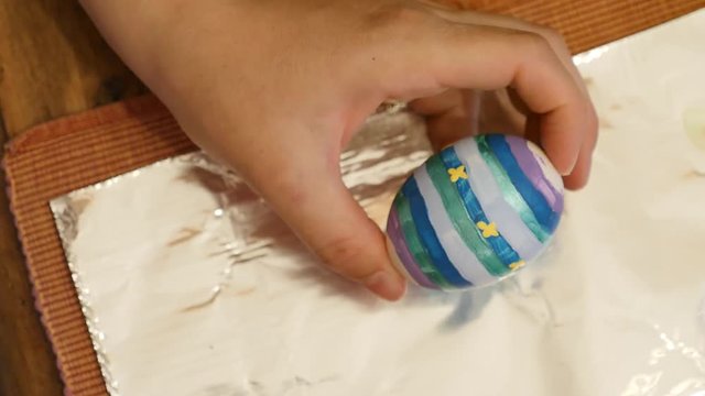 A woman painting eggs for easter holiday