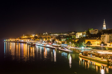 Night view of Belgrade skyline with the river Sava in front