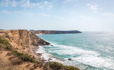 Fototapeta na wymiar Rocky seashore in sunny Portugal