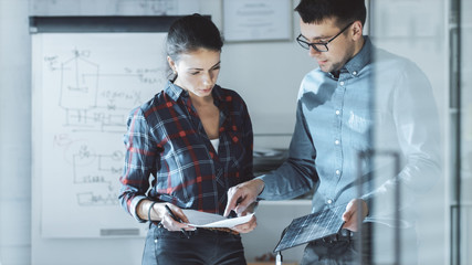 Female Design Engineer Works on Documents in a Conference Room, Last Minute Check-up, Uses Her...