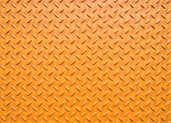 yellow painted industrial steel sheeting with grid textured flooring pattern