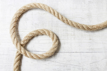 Ship rope isolated on white wood