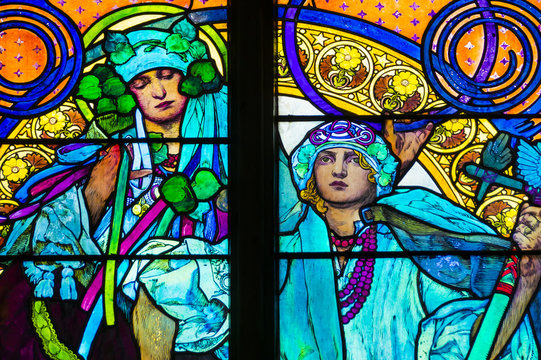 Detail of art nouveau stained glass window by Alfons Mucha, St. Vitus Cathedral, Prague castle, Czech Republic - women who symbolize Czech and Slovakian people
