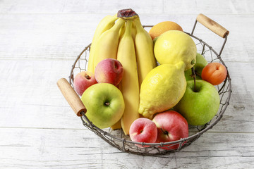 Stack of fruits on wooden table.