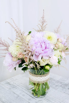 Bouquet with pink peonies, roses and yellow dahlias
