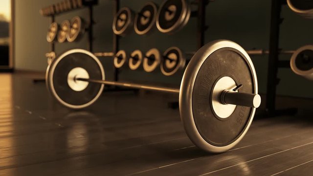 Barbell with Weight Plates On Modern Gym Floor.  Bodybuilding, strength concept