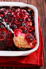 Baked cherry pudding in a tin