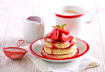 Pancakes with strawberry sauce