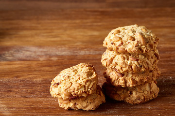 Bunch of chocolate biscuits on a rustic wooden background, close-up, selective focus.