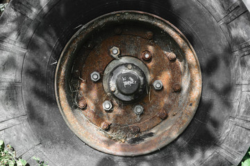 Background Surface of Old and Dirty Tire with Rusty Disc