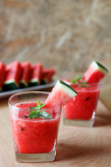 Watermelon drink on wooden background.