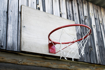 homemade basketball hoop on a wooden wall