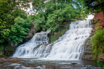 Fototapeta premium Dzhurinsky waterfall - a waterfall on the river Dzhurin in Zaleschitsky district of Ternopil region of Ukraine. The height of the waterfall is 16 meters.