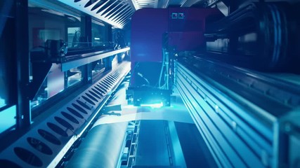 Large format printer printing on a roll of paper at high speed