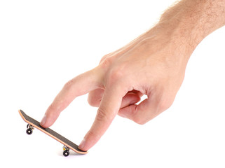 Skateboard toy in hand on a white background isolation