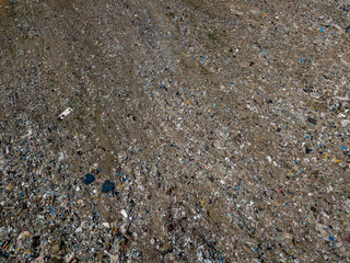 Environmental pollution. Aerial top view photo from flying drone of large garbage pile. Garbage pile in trash dump or landfill.