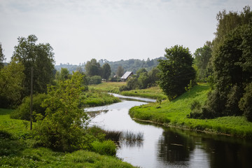 Fototapeta na wymiar View from the bridge to the Abava River in Sabile, Latvia