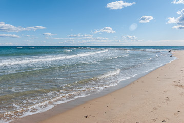 Fototapeta na wymiar Quiet beach of the Mediterranean Sea on the coast of Alicante. Spain