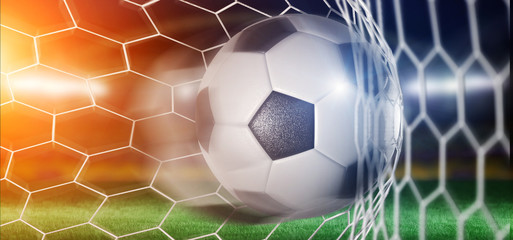 Naklejka premium Football ball in the net of a goal - 3d rendering
