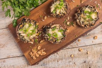 Mushroom caps stuffed with vegetables and cheese