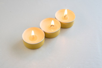 Fototapeta na wymiar aromatic apple candles lit with a warm flame