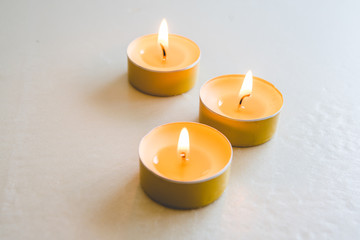Obraz na płótnie Canvas aromatic apple candles lit with a warm flame