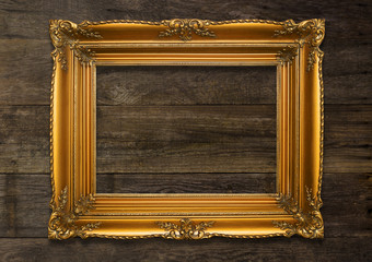 Old Brown Picture Frame on wooden background