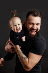 Family values concept. Studio portrait of adorable innocent funny one year old baby girl smiling...