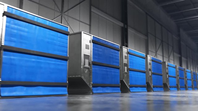 Row of blue industrial modular units in a warehouse