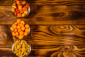 Different snacks for beer on wooden table. Top view