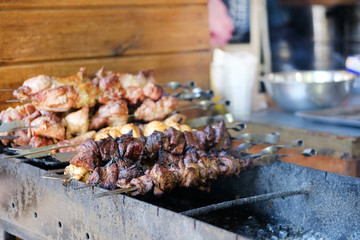 Shish kebab on open fire. Street food and outdoor cooking concept