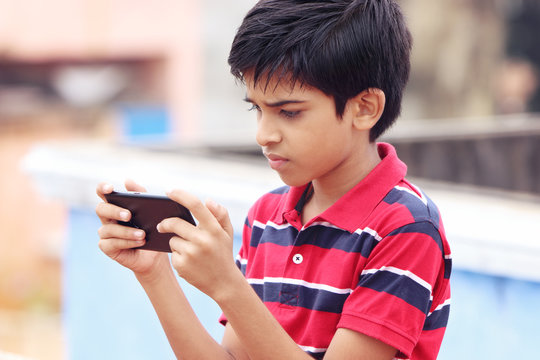     Indian Cute Little Boy With Cellphone 