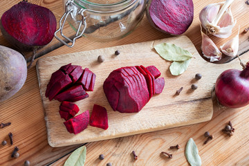 Sliced red beets with garlic and spices - ingredients to prepare beet kvass