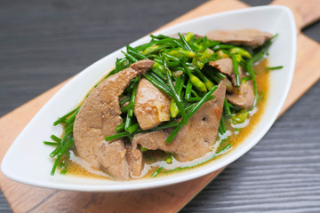 Stir Fried Garlic Chive Flowers with Pork Liver.
