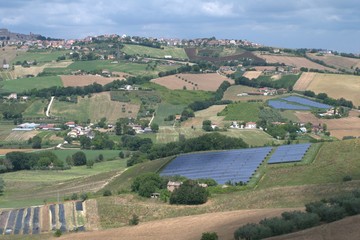 Fototapeta na wymiar Italy,photovoltaic panels,landscape,hills,panorama,crops,agriculture,view,countryside