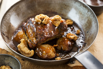Slow cooked pork belly with crackling and pork jus & baby potatoes