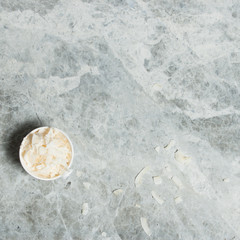 Fototapeta na wymiar Desiccated Coconut. Marble Table.