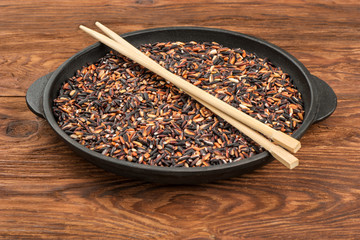 Black rice in pan