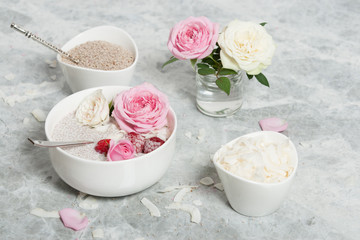 Obraz na płótnie Canvas Chia Seeds Pudding With Coconut. Rose Flowers. Raspberry.