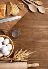 Fototapeta na wymiar Baking Bread. Close Up Of Baking Ingredients On Wood Table